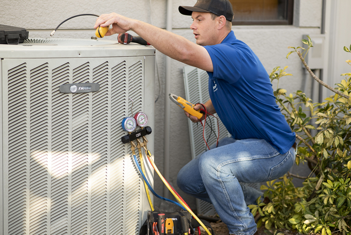 Technician repairing the A/C